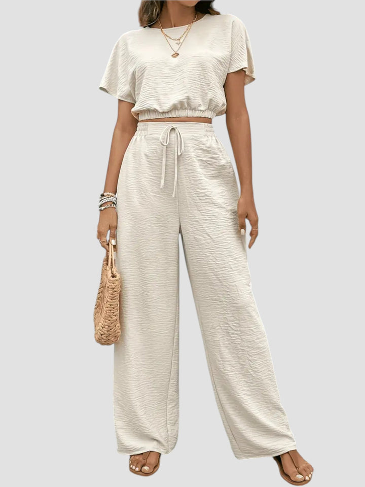 Mirella – Completo moderno con crop top e pantaloni fluidi
