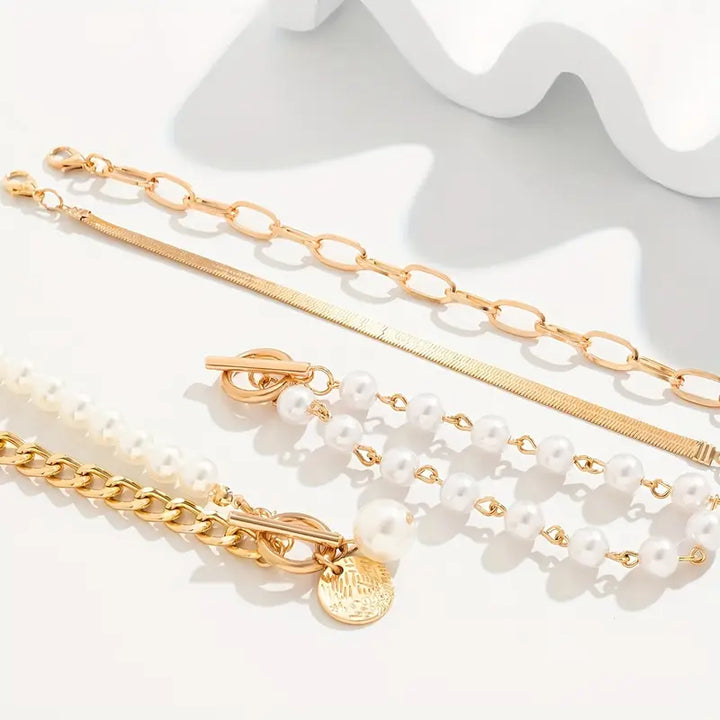 Set di bracciali chic in oro (4 pezzi) – serpente, perle e maglie