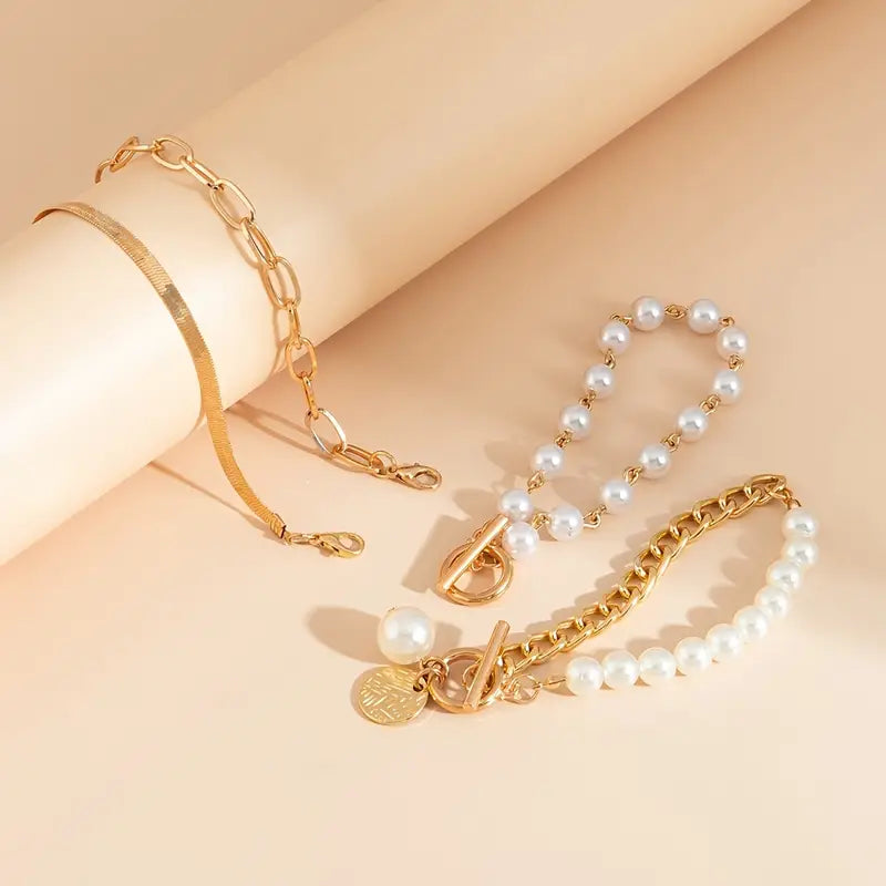 Set di bracciali chic in oro (4 pezzi) – serpente, perle e maglie