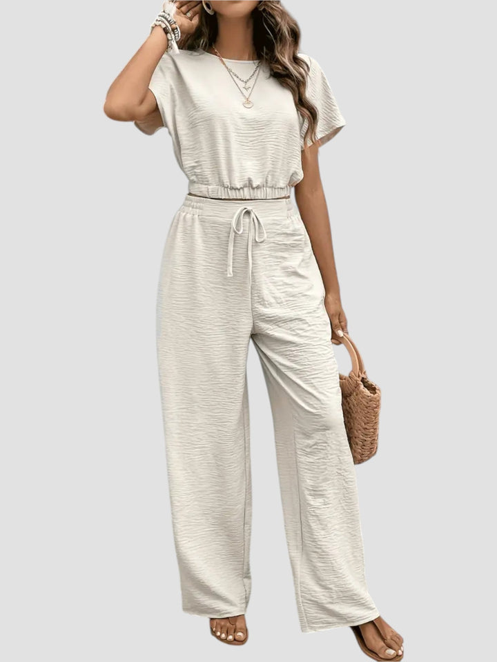 Mirella – Completo moderno con crop top e pantaloni fluidi