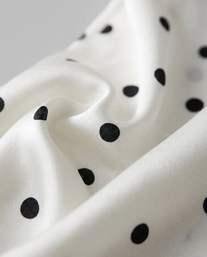 Abito midi a pois con bordino in pizzo